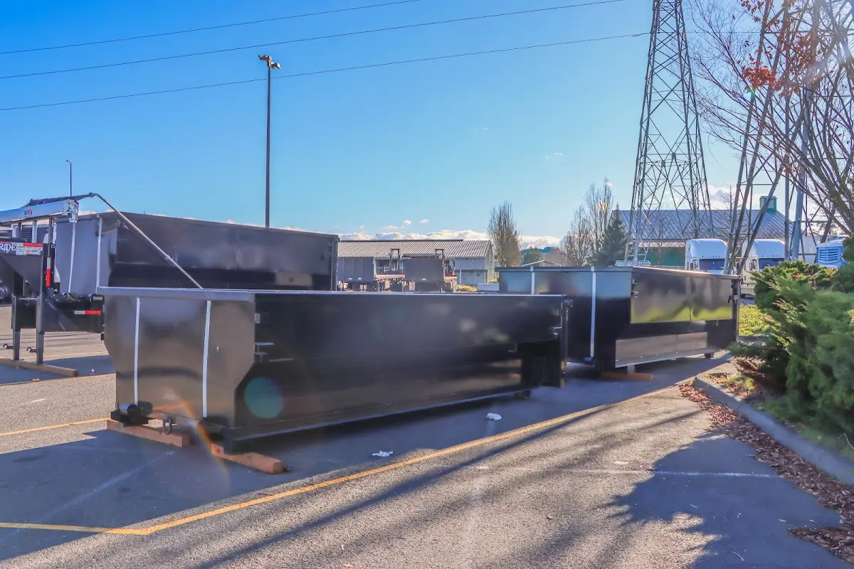 Roll-off dumpster ready for waste disposal at job site for 2 Yard Dumpster Rental in Mayfield